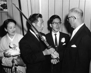 Nobuo Fujita presents his family's sword to the mayor of Brookin